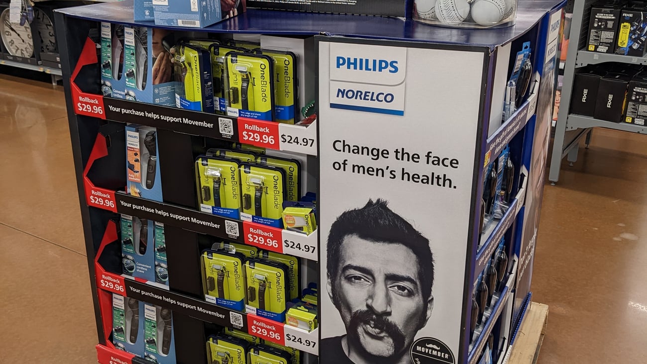 a group of people in front of a shop