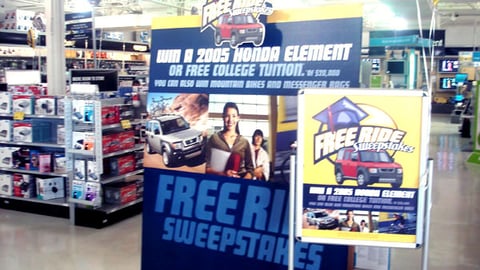 CompUSA 'Free Ride' Sweepstakes Signage
