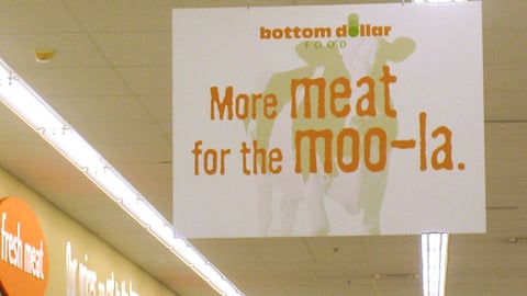 Bottom Dollar 'More Meat' Ceiling Sign