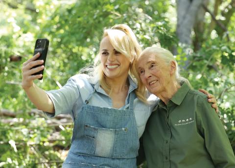 a woman holding a cell phone